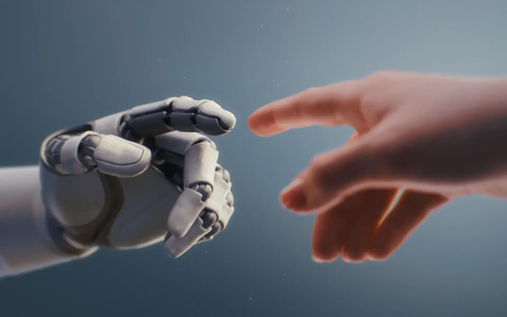 Robotic hand and human hand reaching toward each other